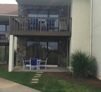 Patio and balcony overlook the green commons area.  Great area for bbq &amp; games.