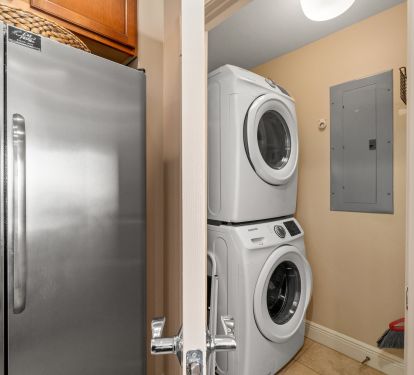 Fridge leading to the washer and dryer.