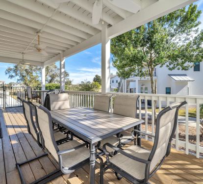 Side porch with seating for six, outdoor TV and gas grill