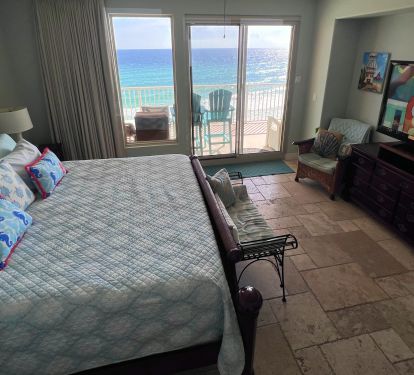 Master bedroom suite with 55" Flat screen TV, DVD player with balcony access with view of Gulf