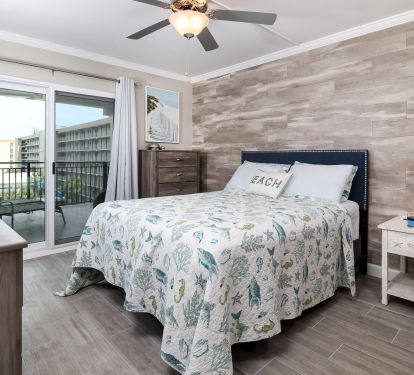 The main bedroom has a king bed and balcony access. 