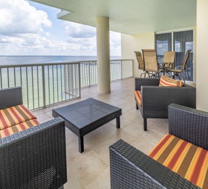 View of the bay from the balcony. Entrance to master bedroom in background.