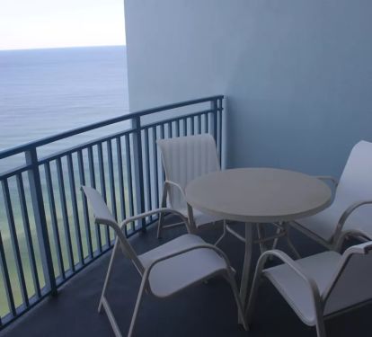 Dining and Lounging area on balcony. See pool deck, hot tub, ocean, pier.
