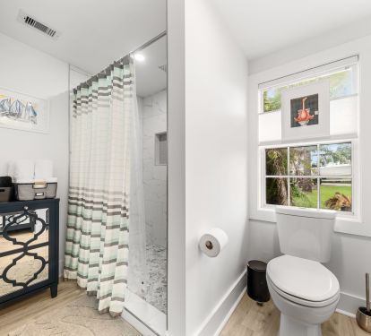 Fully tiled shower sall and clothes hamper