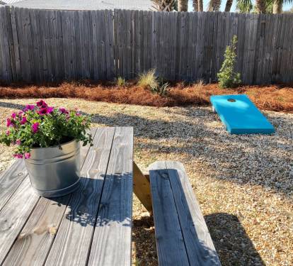 Picnic and Corn Hole Game, backyard is nicely landscaped. Great Play Area!