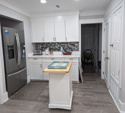 Kitchen with quartz counters and moving island