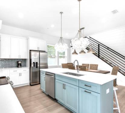 Azure-14 Create your culinary masterpieces in Azure's new kitchen, featuring stainless appliances with quartz counters and subway tile backsplash.