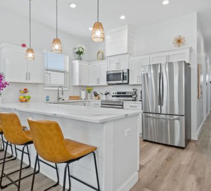 Towards the back of the home is the modern kitchen