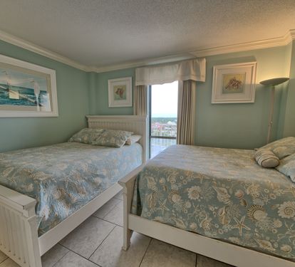 Second Bedroom with 2 double beds and TV.