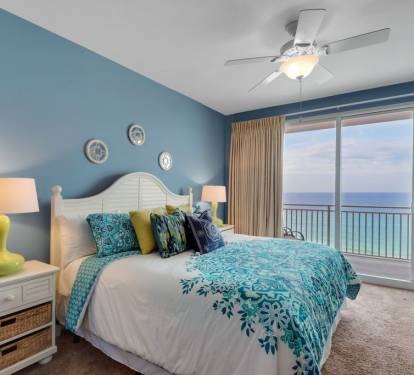 The master bedroom is a cozy escape, with its own balcony access.