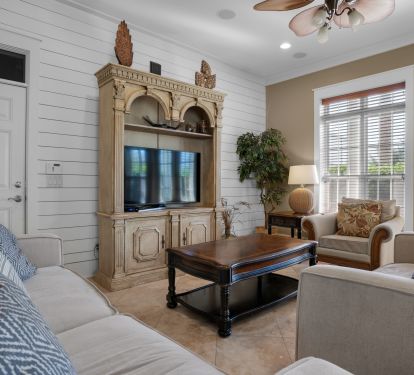 The living room has lots of windows and sunlight!