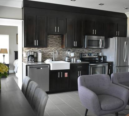 2ND FLOOR LIVING AREA, DINING, &amp; FULL KITCHEN - OPENS TO GULF FRONT BALCONY