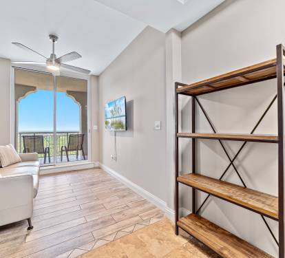 "Bonus Den" with Natuzzi leather sleeper sofa, wall tv,  and "second" balcony