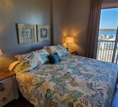 2nd Master Suite with beautiful balcony views of Gulf Shores and the Lagoon.