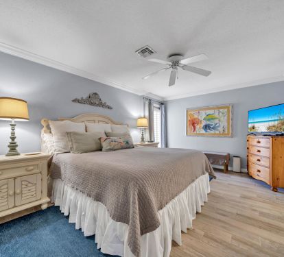 Primary bedroom with king bed, outdoor access and private bath