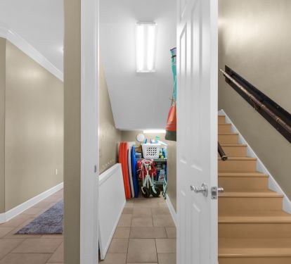 FOYER CLOSET WITH WAGON, TOYS, BOOGIE BOARDS, FLOATS AND EXTRA CHAIRS