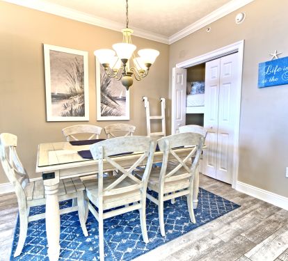 Bunk beds neslted behind dining table area