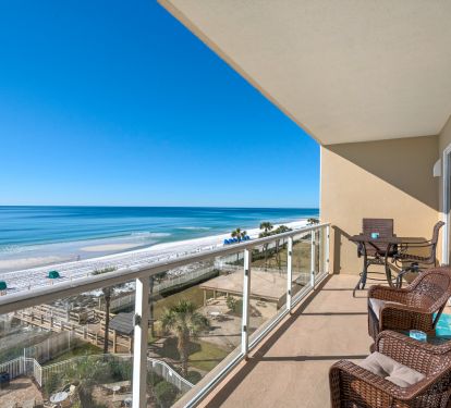 Gulf Front balcony has two lounger, high table top and 2 swivel rockers