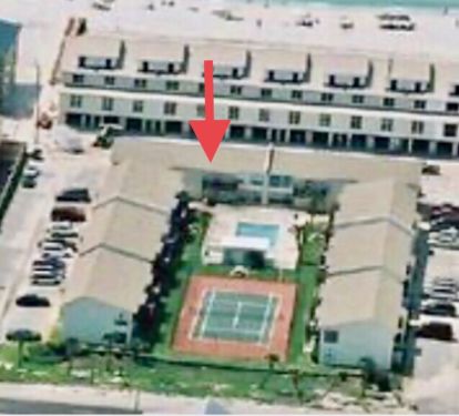 We are here on the main level. Front door goes to the beach, back patio to pool