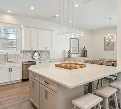 Ovation-13 features a beautiful quartz island for grab-and-go meals, making beach outings effortless for your family!