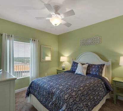 The queen bedroom is spacious, comfortable and inviting.