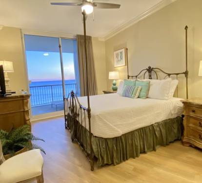 Master with King bed and attached bath with double vanity, tub, and shower