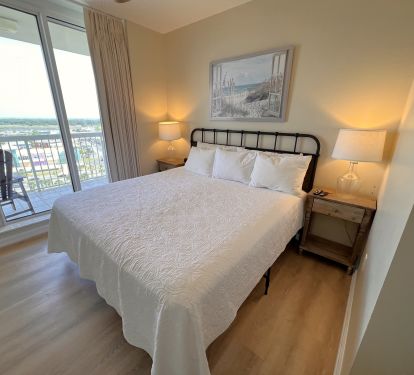 Bedroom #3 has a king size bed and sliding door access to city balcony.