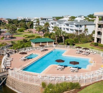 view of the large lap pool and hot tub