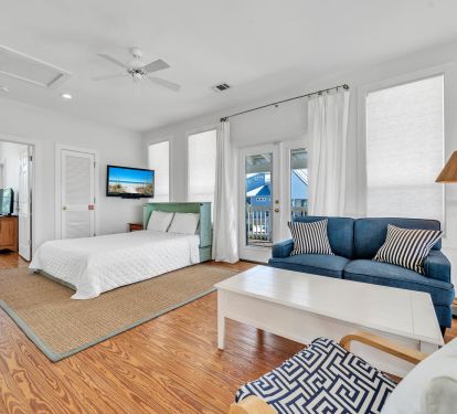 Upstairs loft with sitting area, access to porch, queen Murphy bed and TV