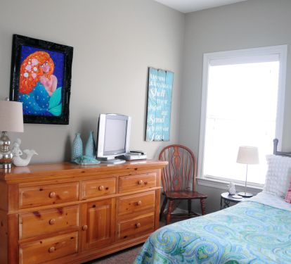 First floor bedroom with TV and dresser