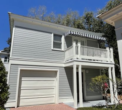 Enter the carriage house from the driveway or rear gate along The Promenade