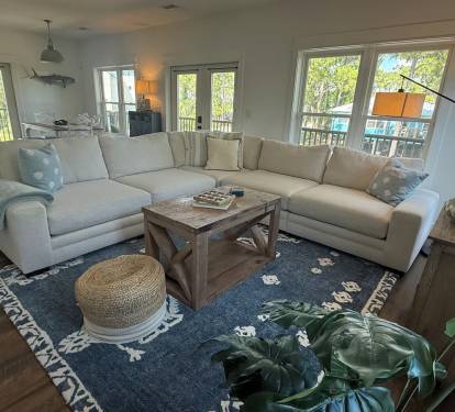 Living Room with comfortable sectional sofa, games, and tv.