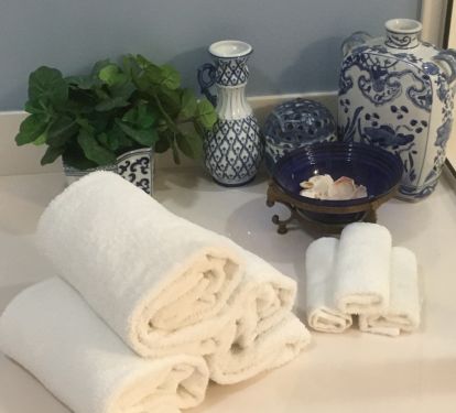 A large master bathroom provides all the conveniences.