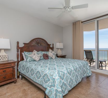 Master Bedroom w/Kind Bed and Balcony Access