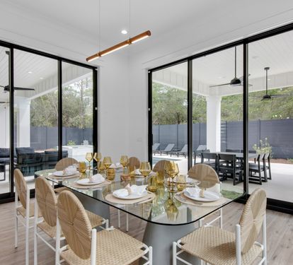The modern coastal dining table comfortably sits 8 people.