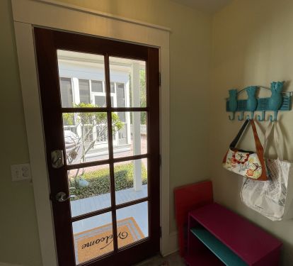 Entry foyer w/ full size washer &amp; dryer and storage