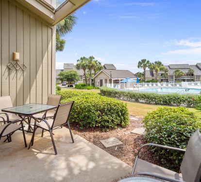 Patio has view of pool and gulf