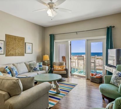 Main living area with beach views and HD TV, cable channels provided!!