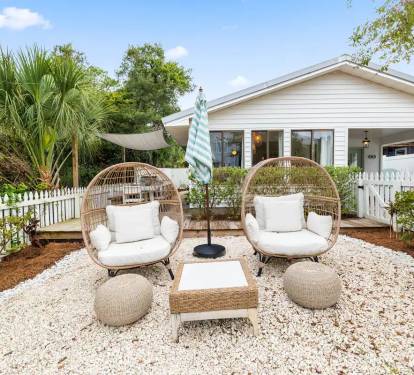 Patio with chairs and umbrella. Perfect for a book or morning tea!