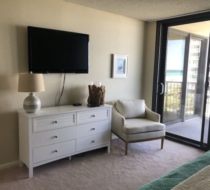 Master bedroom. 46&rdquo; Flatscreen TV. Patio doors to balcony.