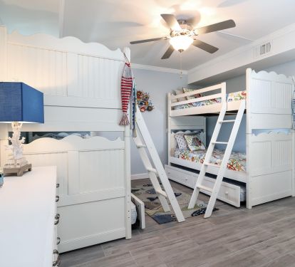 The bunk bedroom has four bunk beds and two trundles. 