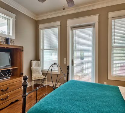View of upstairs guest bedroom from bathroom entry.