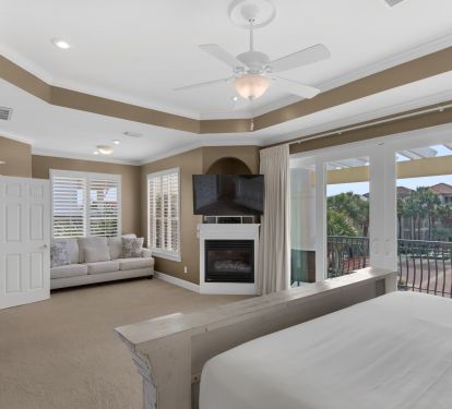MAIN BEDROOM WITH LARGE KING BED AND SLEEPER SOFA