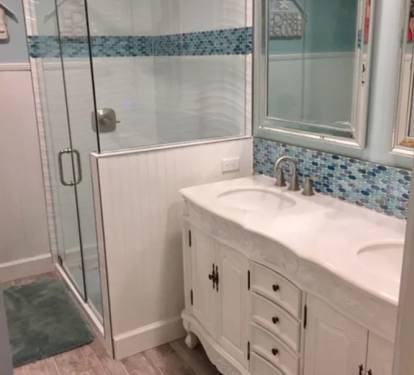 Upstairs bathroom has European shower, double sink vanity.  