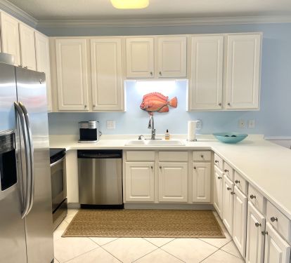 KITCHEN IS WELL STOCKED AND SPACIOUS FOR PREPARING YOUR FAVORITE MEALS 