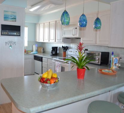 Kitchen with Bar and Four Stools
