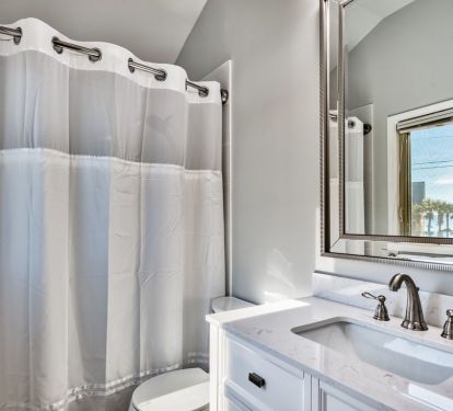 Second floor bath has tub/shower (and view of the beach)