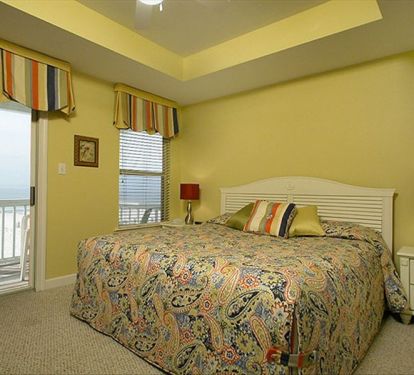 Beautiful custom bedding and drapes grace extra large king rooms in the house