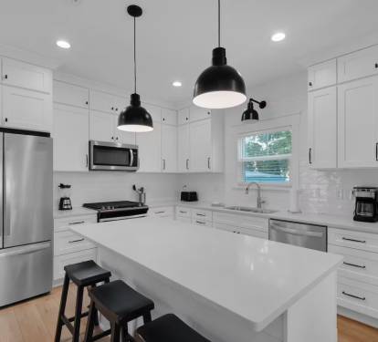Clean white gourmet kitchen.