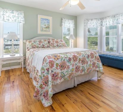 Queen main level bedroom with pool views